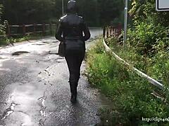 A leather-clad mom in shiny wellies takes a walk