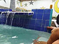 Indian mature and young Brazilian couple in the pool