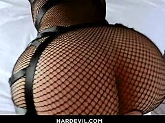 Monster boobs of Demon Isis Love in black lingerie and fishnets