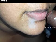 A mature Indian woman receives a large load in her mouth