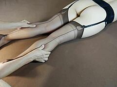 Nylon-clad milf enjoys foot massage in stockings